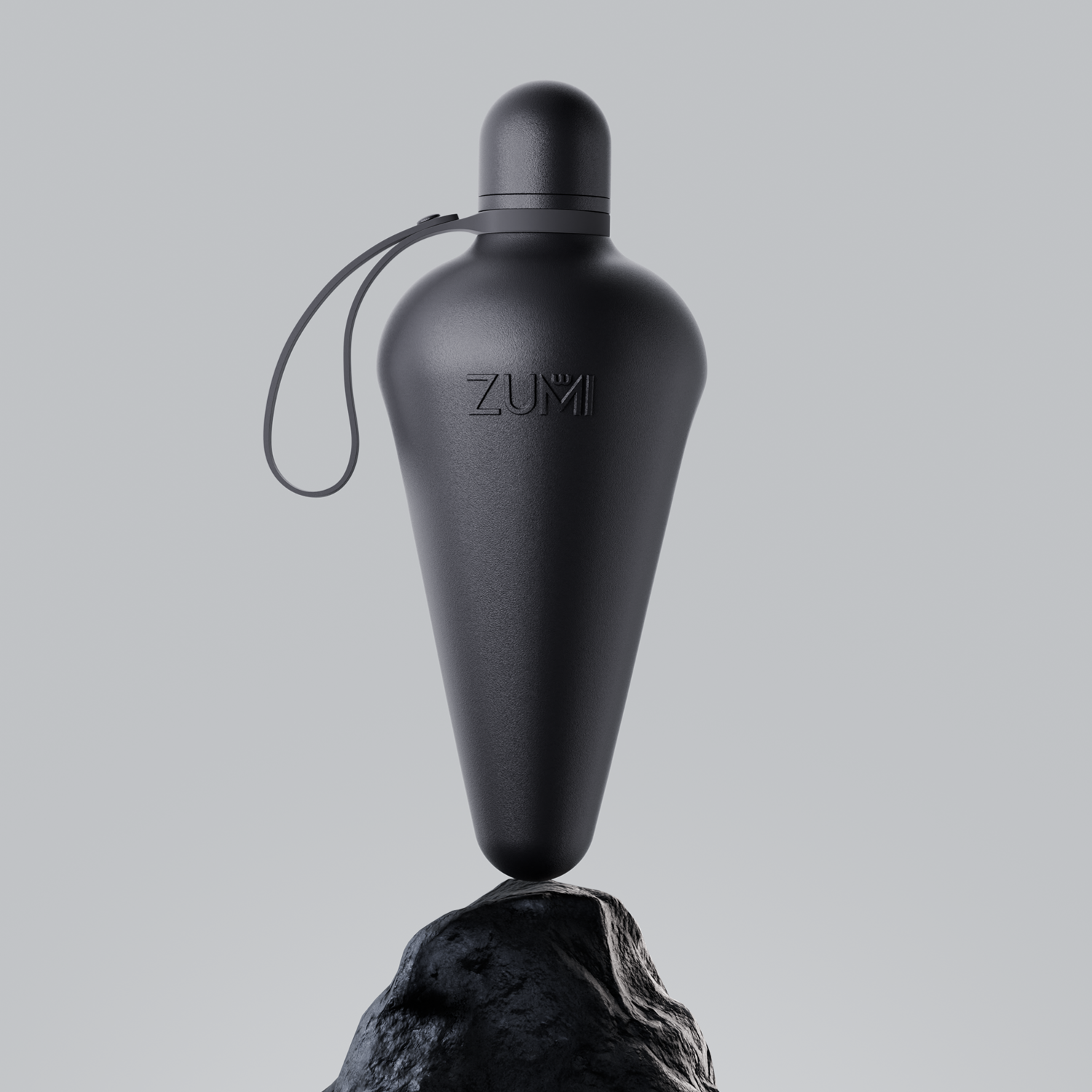 A black stainless steel reusable water bottle with a loop on the lid, branded with 'ZUMI'.