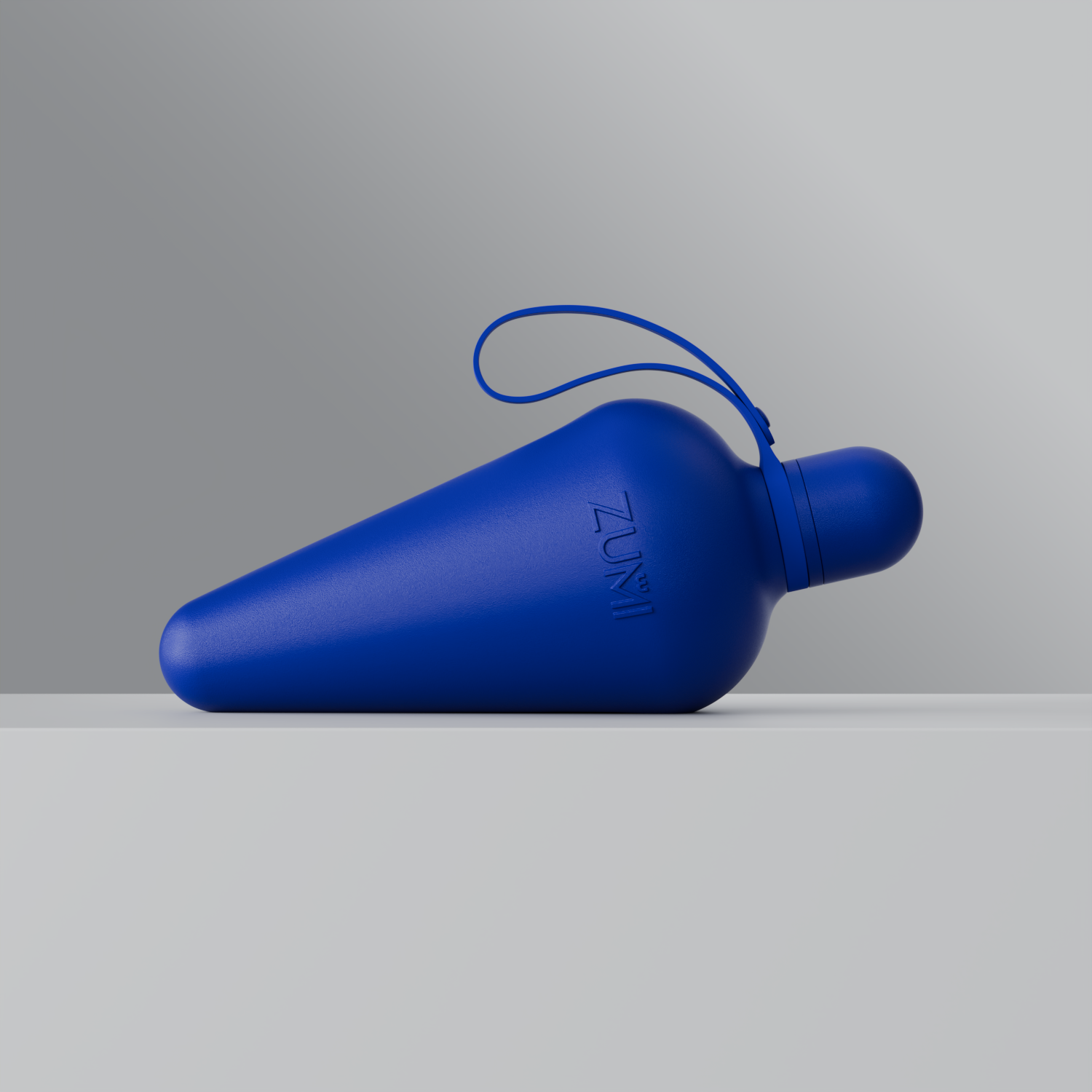 A Blue stainless steel reusable water bottle with a loop on the lid, branded with 'ZUMI'.