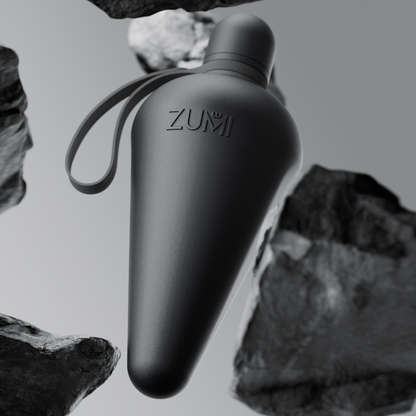 A black stainless steel reusable water bottle with a loop on the lid, branded with 'ZUMI'.