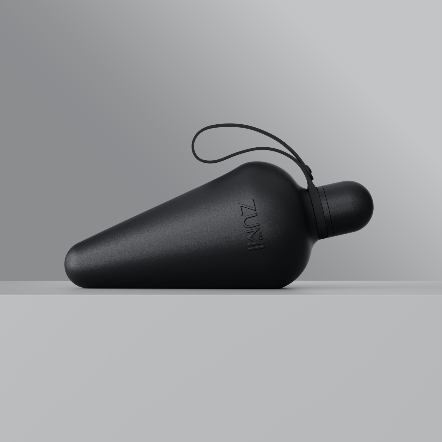 A black stainless steel reusable water bottle with a loop on the lid, branded with 'ZUMI'.