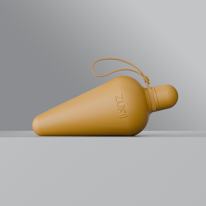 A beige stainless steel reusable water bottle with a loop on the lid, branded with 'ZUMI'.