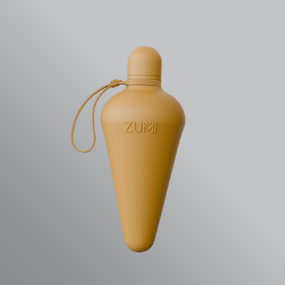 A beige stainless steel reusable water bottle with a loop on the lid, branded with 'ZUMI'.